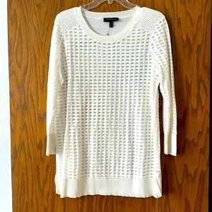 Off-white lightweight sweater.